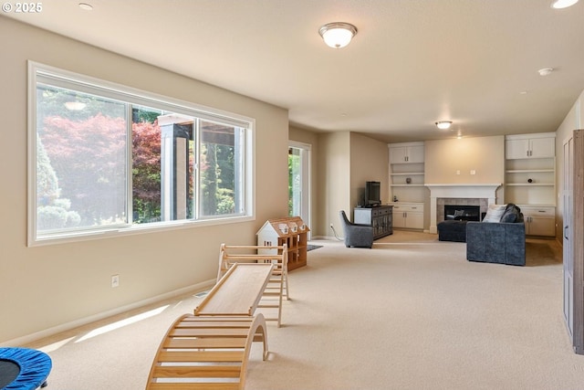 2814 NW Hill St, Camas, WA 98607 - living area featuring light colored carpet, a fireplace, and built in features
