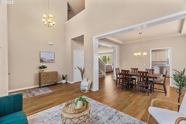 2814 NW Hill St, Camas, WA 98607 - living room with a chandelier, wood finished floors, stairway, and a tray ceiling