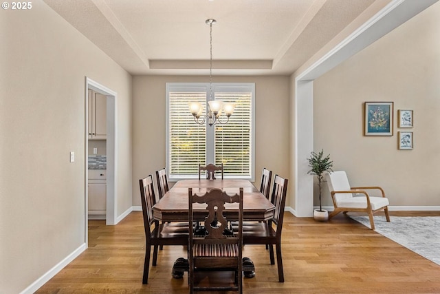 2814 NW Hill St, Camas, WA 98607 - dining area with a chandelier, a raised ceiling, and light wood finished floors