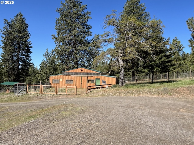 view of front of house with fence