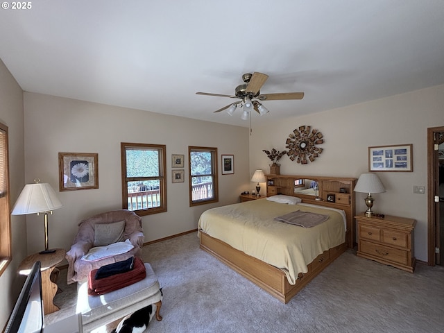 bedroom featuring ceiling fan, carpet, and baseboards
