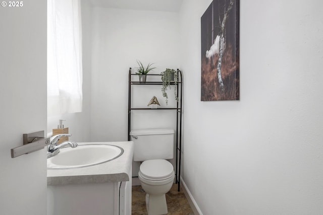 9259 SE Clay St, Portland, OR 97216 - bathroom featuring vanity, toilet, and baseboards