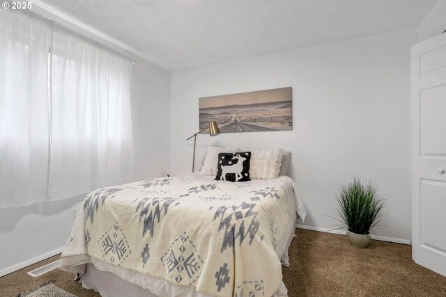 9259 SE Clay St, Portland, OR 97216 - bedroom featuring carpet floors, a textured ceiling, and baseboards