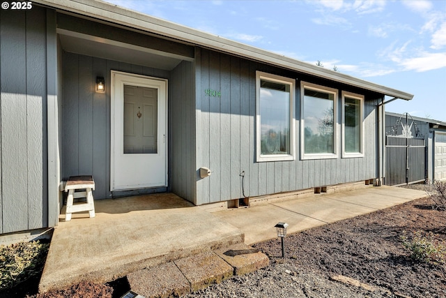 property entrance featuring a patio area