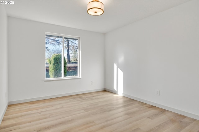 spare room featuring light hardwood / wood-style floors