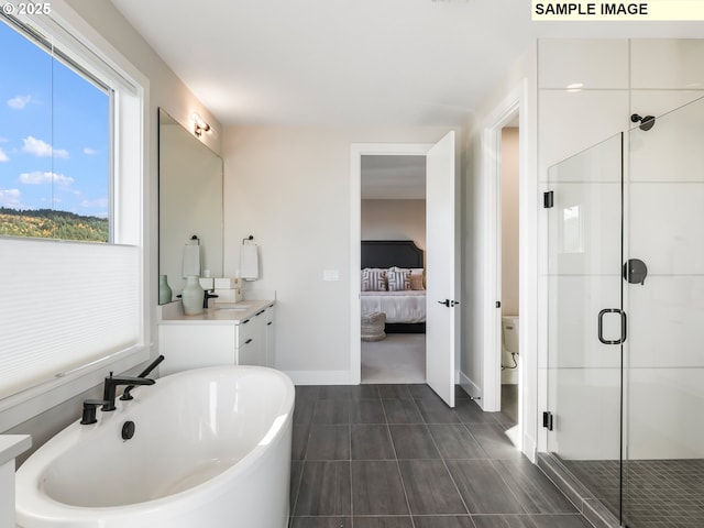 bathroom featuring vanity, tile patterned flooring, and separate shower and tub