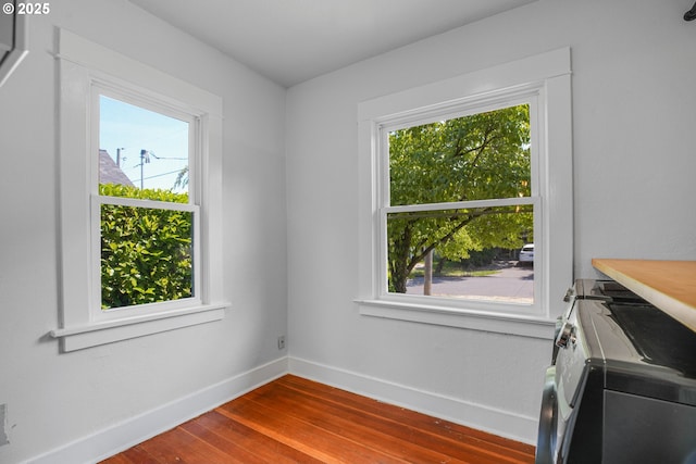 1605 NE 76th Ave, Portland, OR 97213 - unfurnished dining area with dark wood finished floors and baseboards