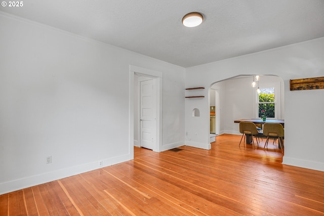 1605 NE 76th Ave, Portland, OR 97213 - unfurnished room with arched walkways and light wood-style floors