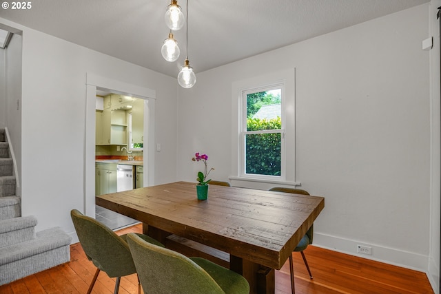 1605 NE 76th Ave, Portland, OR 97213 - dining area featuring stairs and light wood-type flooring