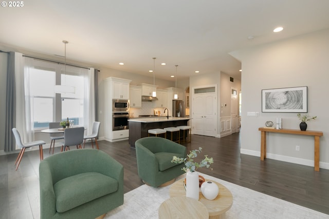 16922 NW Madrone St, Portland, OR 97229 - living area with recessed lighting, dark wood finished floors, and baseboards