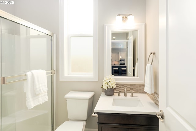 16922 NW Madrone St, Portland, OR 97229 - bathroom with tasteful backsplash, vanity, a stall shower, and toilet