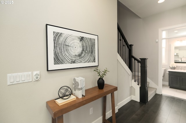 16922 NW Madrone St, Portland, OR 97229 - stairway with wood finished floors, recessed lighting, and baseboards