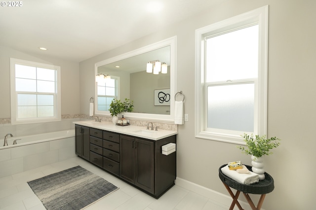 16922 NW Madrone St, Portland, OR 97229 - bathroom with a bath, double vanity, tile patterned floors, and recessed lighting