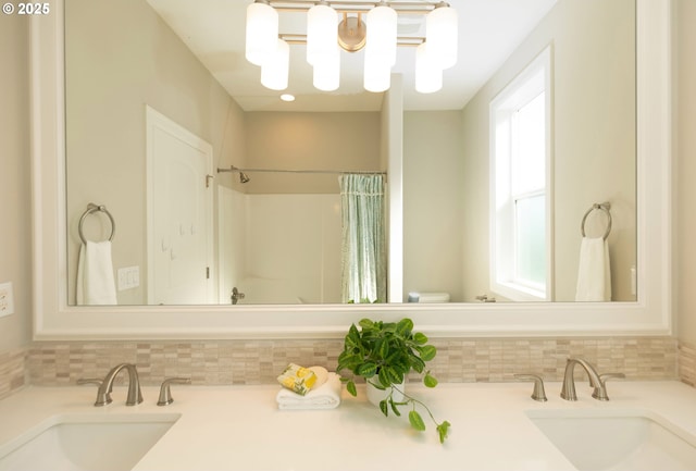 16922 NW Madrone St, Portland, OR 97229 - full bath featuring decorative backsplash, toilet, curtained shower, and vanity