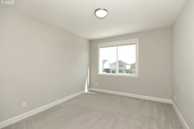 16922 NW Madrone St, Portland, OR 97229 - empty room featuring light colored carpet and baseboards