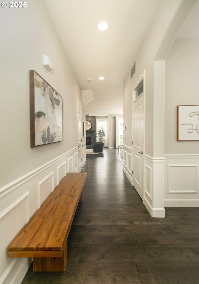 16922 NW Madrone St, Portland, OR 97229 - corridor with recessed lighting, dark wood-style flooring, a decorative wall, and a wainscoted wall