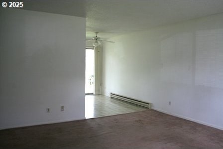 14737 SW Hall Blvd, Tigard, OR 97224 - spare room with a baseboard heating unit and a ceiling fan