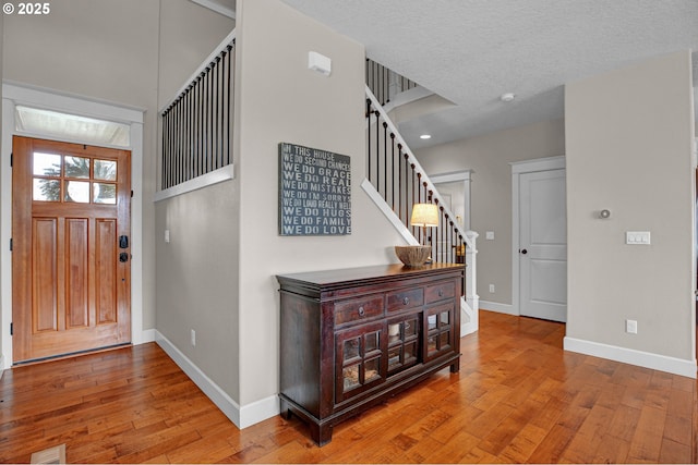 14670 SW 78th Ave, Tigard, OR 97224 - foyer with stairway, hardwood / wood-style floors, and baseboards