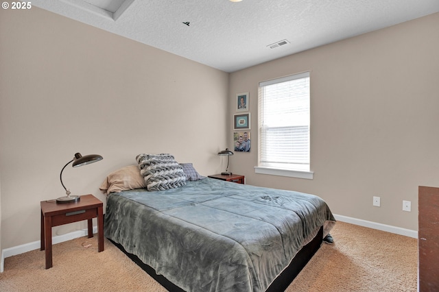 14670 SW 78th Ave, Tigard, OR 97224 - carpeted bedroom with baseboards, a textured ceiling, and attic access