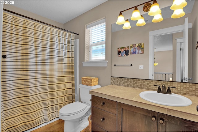 14670 SW 78th Ave, Tigard, OR 97224 - full bathroom featuring vanity, toilet, backsplash, and curtained shower