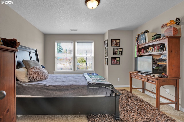 14670 SW 78th Ave, Tigard, OR 97224 - bedroom featuring carpet floors, a textured ceiling, and baseboards