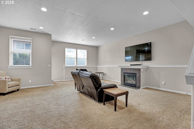 14670 SW 78th Ave, Tigard, OR 97224 - carpeted living area featuring recessed lighting, a textured ceiling, a fireplace, and baseboards