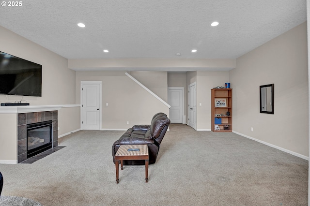 14670 SW 78th Ave, Tigard, OR 97224 - carpeted living room featuring recessed lighting, stairway, baseboards, a fireplace, and a textured ceiling