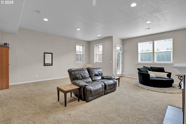 14670 SW 78th Ave, Tigard, OR 97224 - carpeted living room featuring recessed lighting, a textured ceiling, plenty of natural light, and baseboards