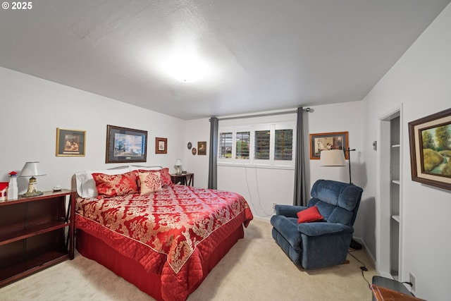 bedroom with light colored carpet