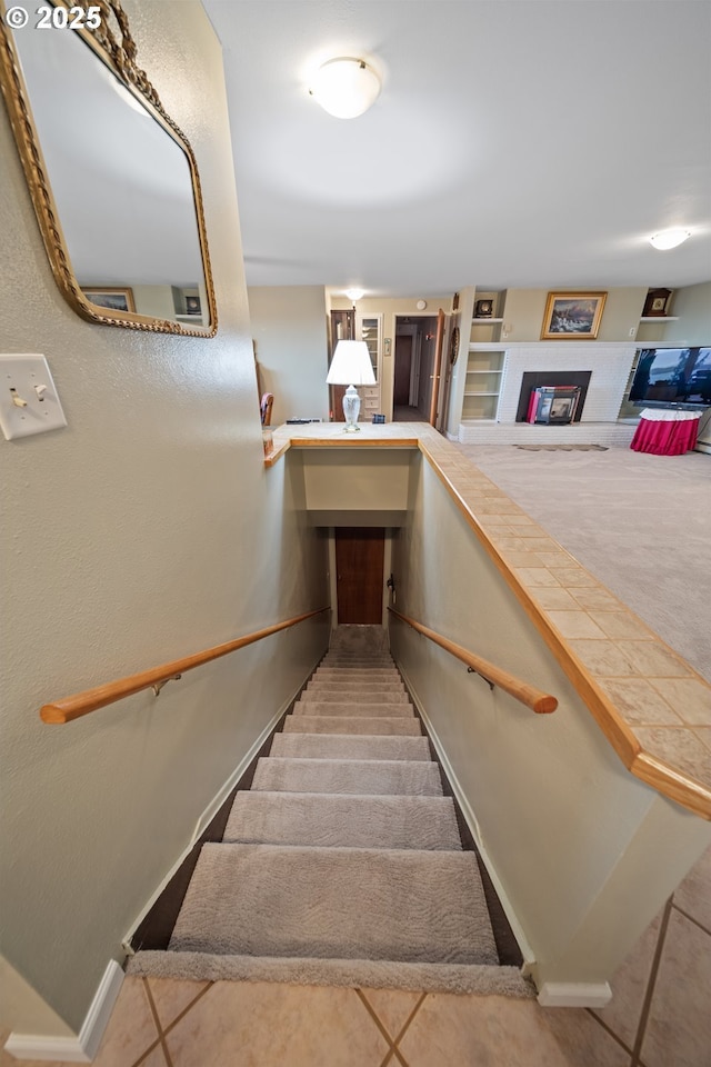 stairs with tile patterned flooring