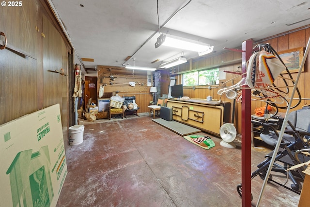 basement featuring wooden walls