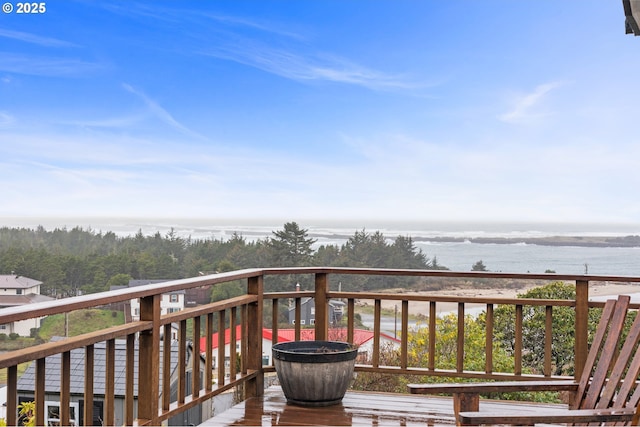 wooden terrace with a water view