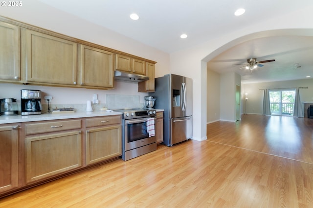 kitchen with stainless steel appliances, a ceiling fan, under cabinet range hood, light countertops, and recessed lighting