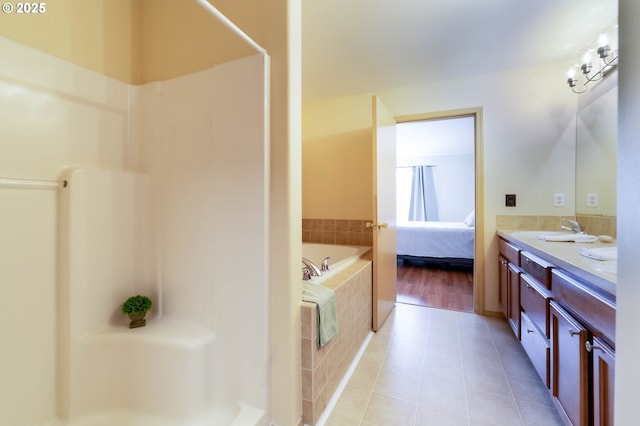 bathroom with tile patterned flooring, a shower, and connected bathroom
