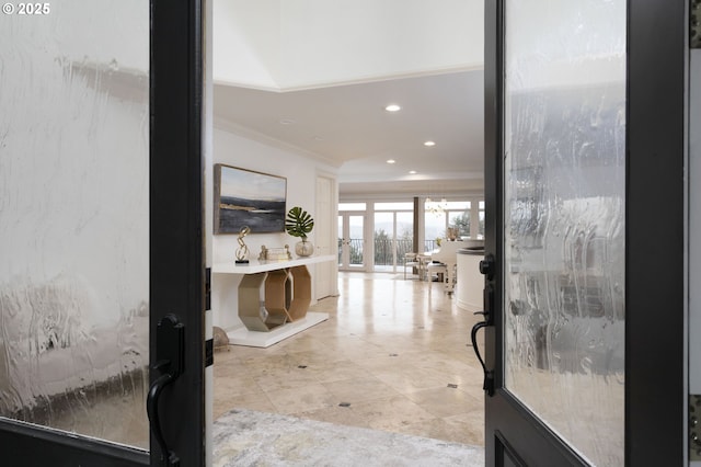 hall with crown molding and recessed lighting