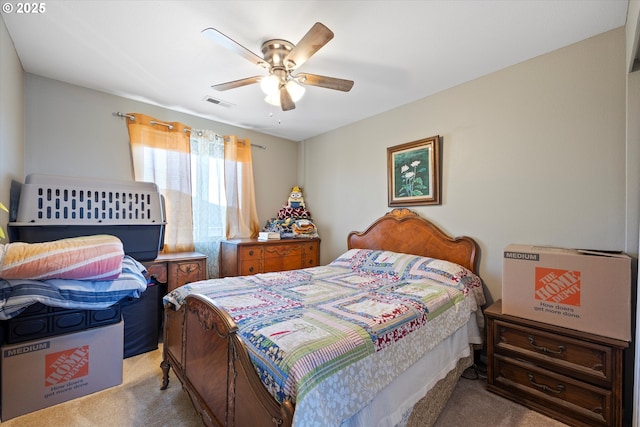 bedroom with light carpet and ceiling fan