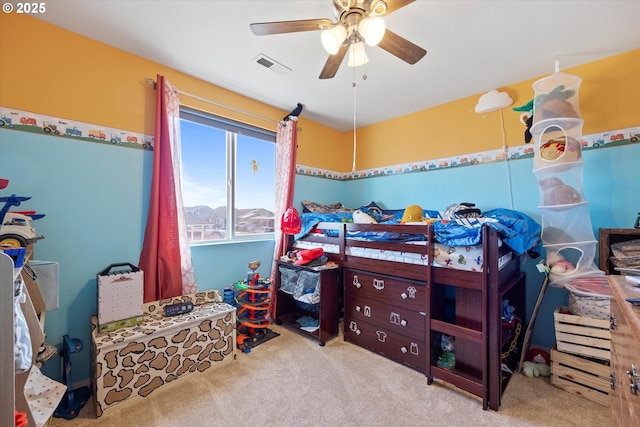 bedroom with light colored carpet and ceiling fan