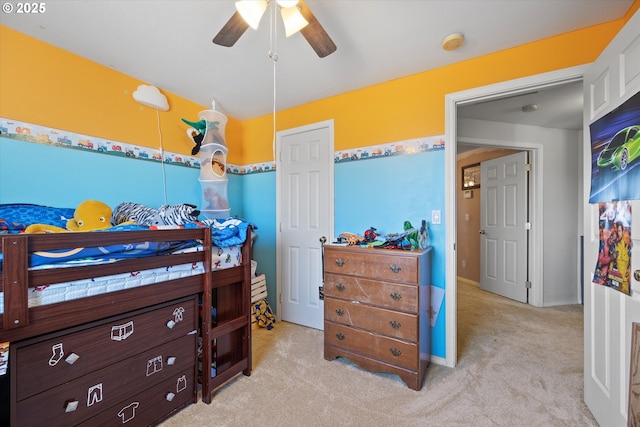 carpeted bedroom featuring ceiling fan