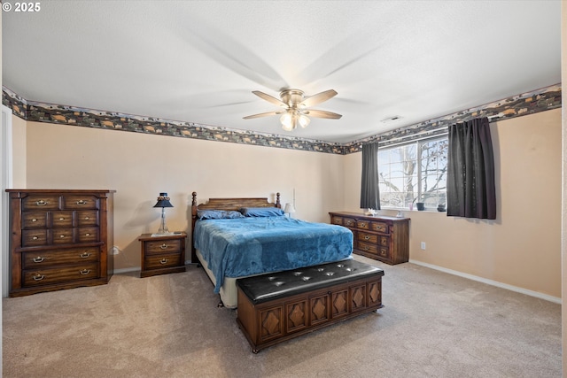 bedroom featuring light colored carpet and ceiling fan