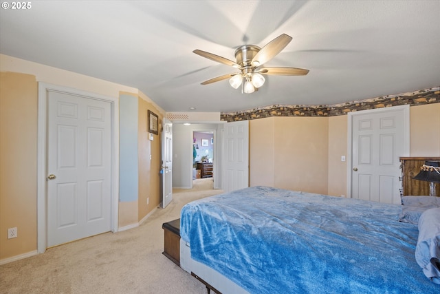 bedroom featuring ceiling fan and light colored carpet