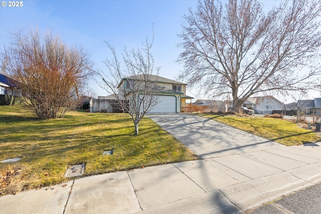 view of front facade with a garage and a front yard