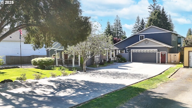 2507 NE 59th St, Vancouver, WA 98663 - view of front facade featuring driveway, an attached garage, and a porch