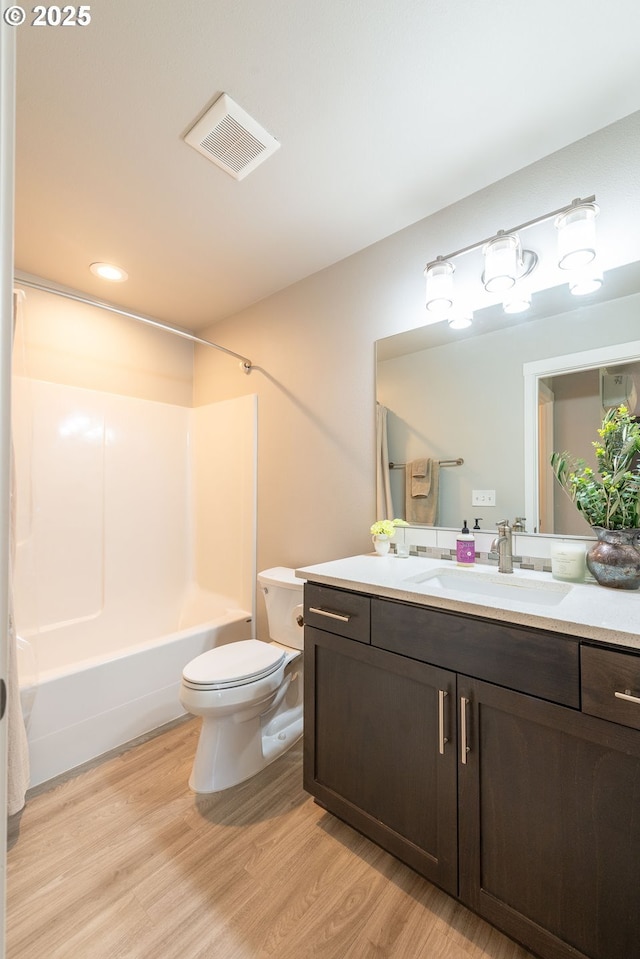 2507 NE 59th St, Vancouver, WA 98663 - full bathroom featuring toilet, wood finished floors, vanity, shower / tub combination, and recessed lighting