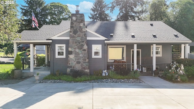 2507 NE 59th St, Vancouver, WA 98663 - view of front of property with a porch, a shingled roof, and a chimney