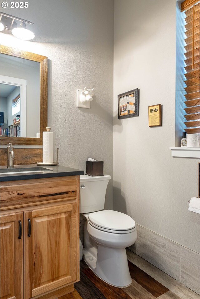 2507 NE 59th St, Vancouver, WA 98663 - half bathroom with vanity, toilet, and wood finished floors