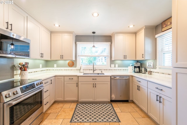 2507 NE 59th St, Vancouver, WA 98663 - kitchen featuring appliances with stainless steel finishes, a sink, healthy amount of natural light, light countertops, and recessed lighting