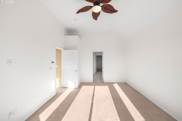 interior space with high vaulted ceiling, ceiling fan, and light colored carpet