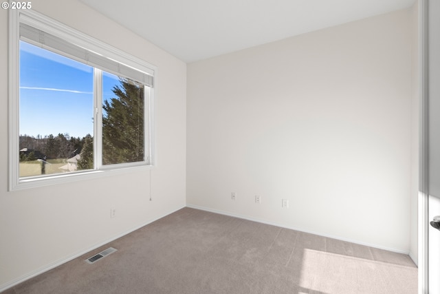 empty room featuring light colored carpet