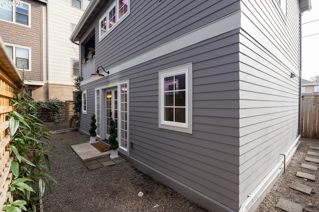 view of home's exterior with fence