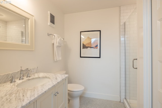 full bathroom with a stall shower, toilet, baseboards, and tile patterned floors